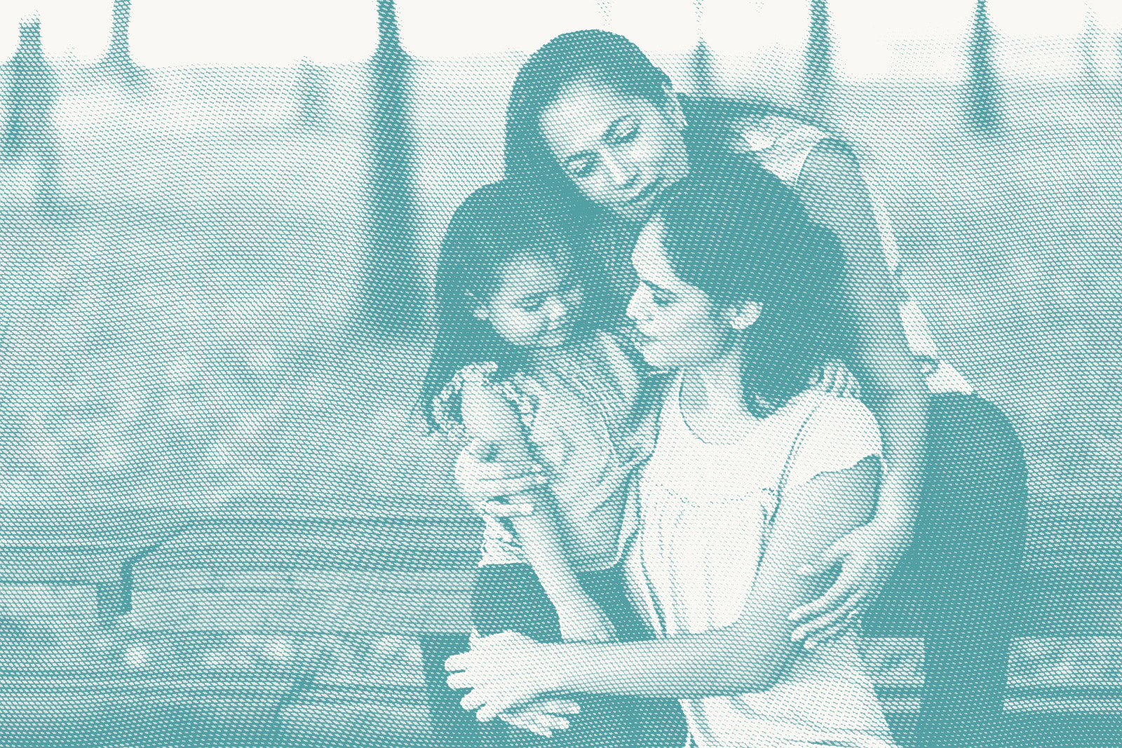 three generations of latina women sit on a bench