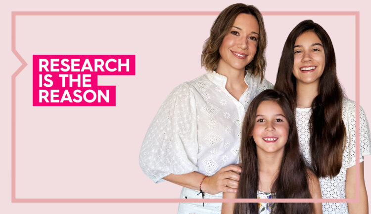 a portrait of marisa and her two daughters against a light pink background