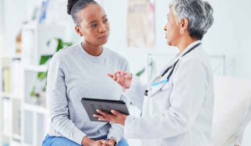 a woman talks with her doctor