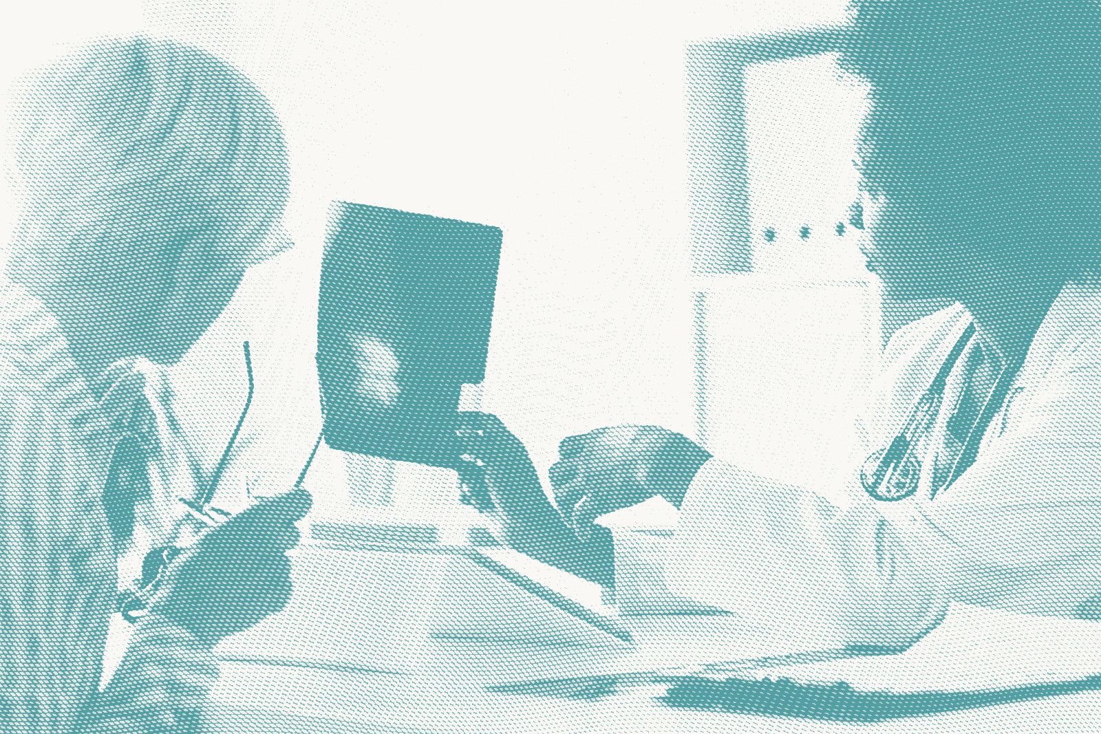 A doctor shows a woman her mammogram results