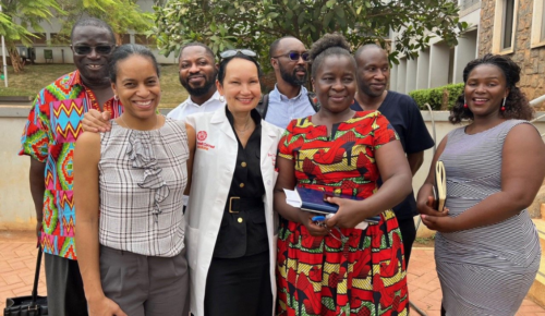 Dr. Lisa Newman stands with colleagues in Africa who she works with through ICSBCS