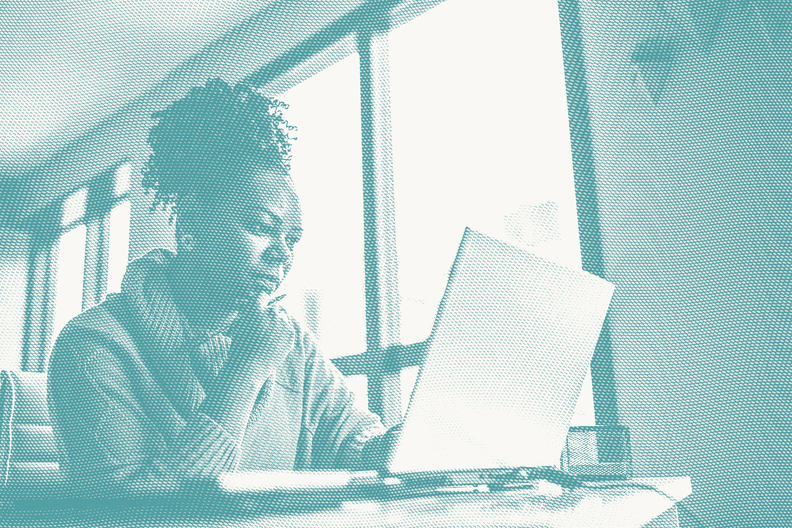 A woman looks at lab results at a desk